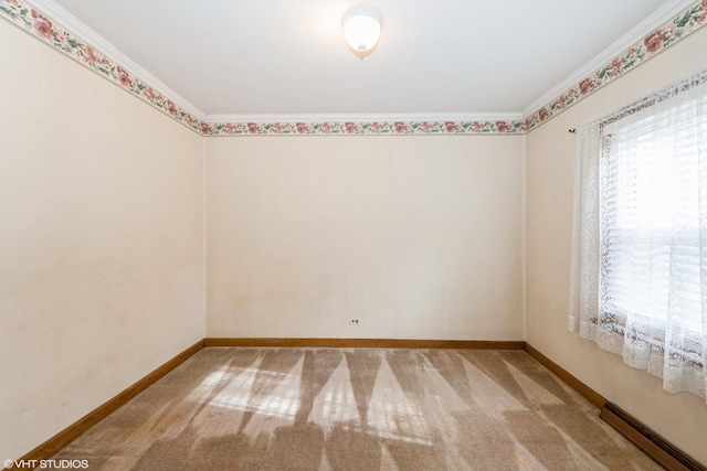 carpeted empty room with baseboards, ornamental molding, and baseboard heating