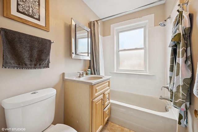 bathroom featuring vanity, toilet, and shower / tub combo