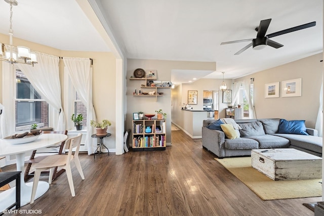 938 Washington Blvd Unit 3W, Oak Park, IL 60302 - living area with baseboards, wood finished floors, and ceiling fan with notable chandelier