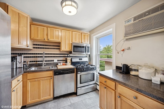 938 Washington Blvd Unit 3W, Oak Park, IL 60302 - kitchen with light brown cabinetry, appliances with stainless steel finishes, a sink, a wall mounted air conditioner, and tasteful backsplash