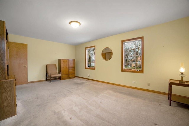 unfurnished room with baseboards and carpet flooring