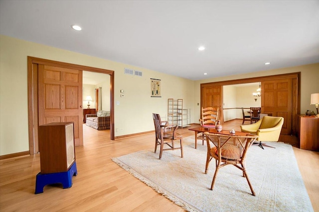 dining area with recessed lighting, baseboards, visible vents, and light wood-style flooring
