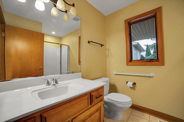 bathroom featuring visible vents, vanity, toilet, tile patterned floors, and a stall shower