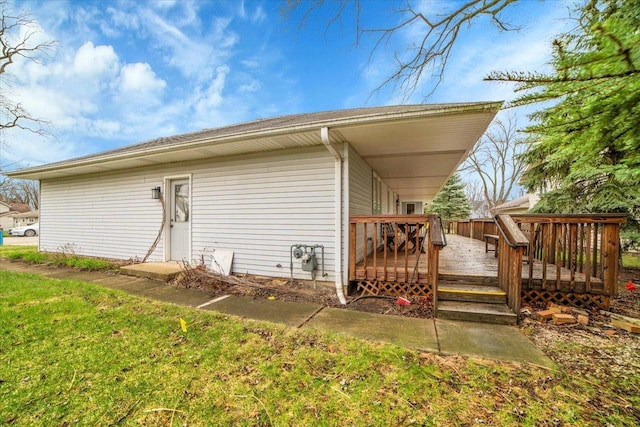 view of property exterior with a deck