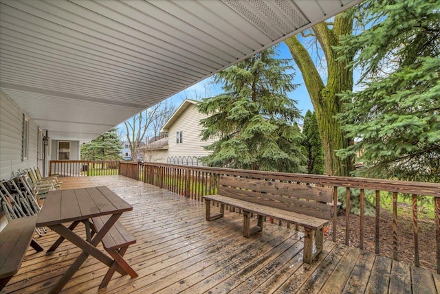 deck featuring outdoor dining area
