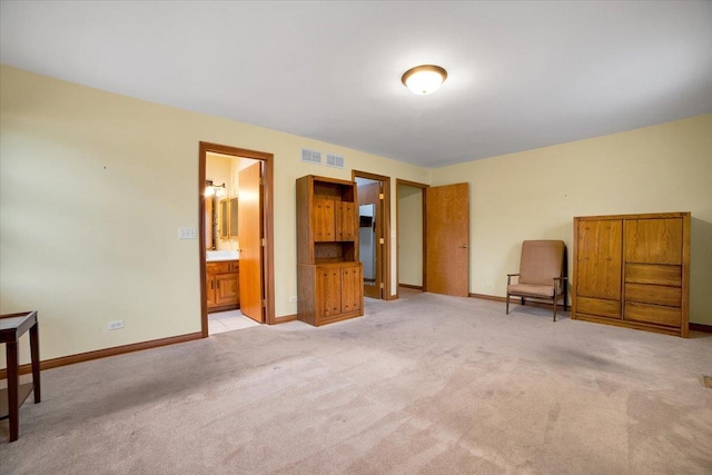 unfurnished room with baseboards, light carpet, and visible vents