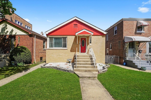 3517 S 59th Ave, Cicero, IL 60804 - bungalow with a front yard, brick siding, a gate, and entry steps