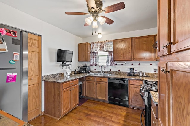 14004 Whipple St, Blue Island, IL 60406 - kitchen featuring brown cabinets, a sink, dishwasher, wood finished floors, and gas range