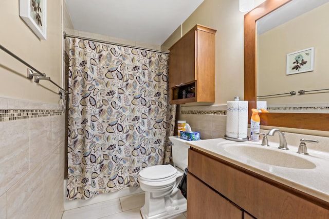 14004 Whipple St, Blue Island, IL 60406 - bathroom featuring tile patterned flooring, vanity, toilet, tile walls, and a wainscoted wall