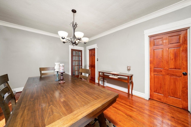 1314 S 59th Ct, Cicero, IL 60804 - dining space with a chandelier, crown molding, and baseboards
