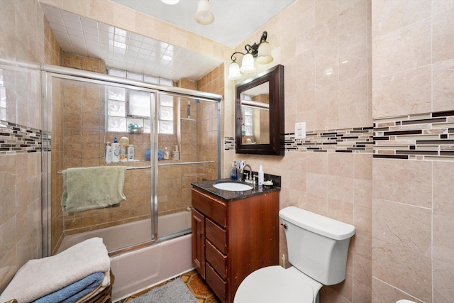 1314 S 59th Ct, Cicero, IL 60804 - full bathroom featuring tile walls, toilet, enclosed tub / shower combo, and vanity