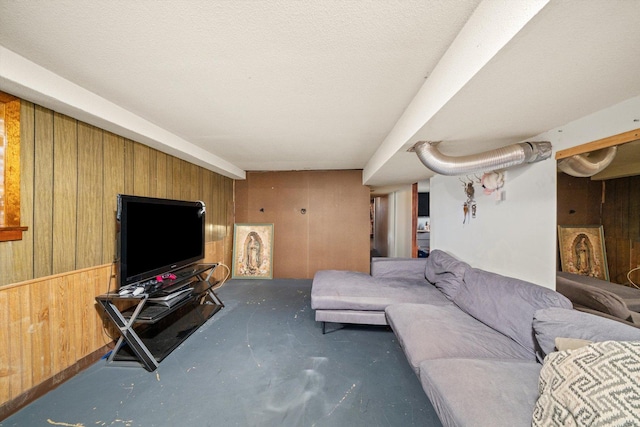 1314 S 59th Ct, Cicero, IL 60804 - living room with wood walls, concrete floors, and a textured ceiling