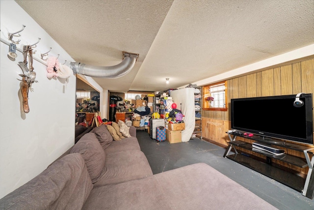 1314 S 59th Ct, Cicero, IL 60804 - living area with a textured ceiling, wooden walls, and finished concrete flooring