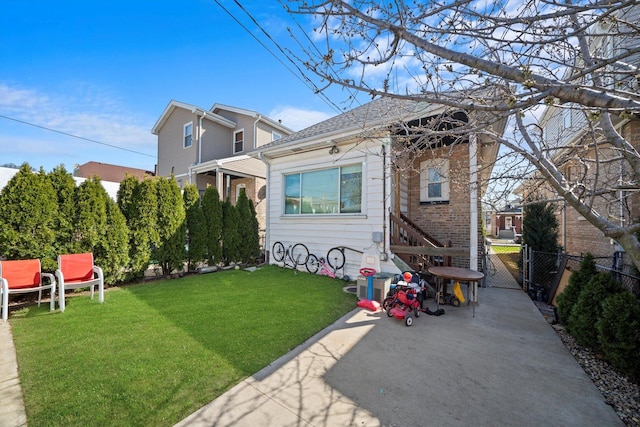 1314 S 59th Ct, Cicero, IL 60804 - rear view of property with a yard, fence, and a gate