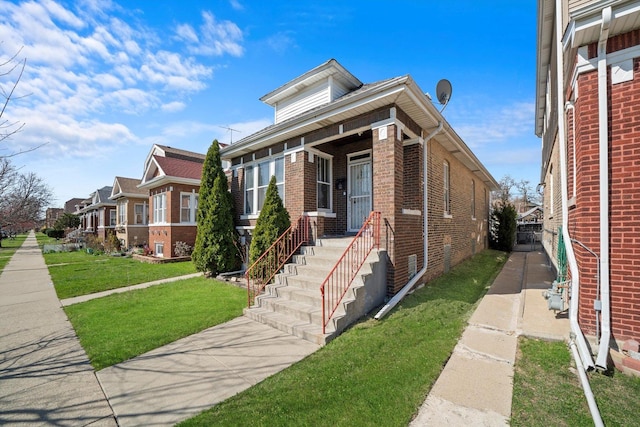 1314 S 59th Ct, Cicero, IL 60804 - bungalow-style house with brick siding and a front yard