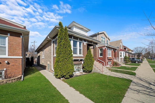 1314 S 59th Ct, Cicero, IL 60804 - view of side of property with a residential view, brick siding, and a lawn