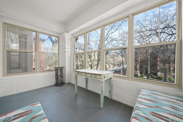 unfurnished sunroom featuring tile patterned floors