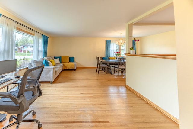 750 Evergreen Ln, Bartlett, IL 60103 - office space featuring a chandelier, healthy amount of natural light, light wood finished floors, and baseboards