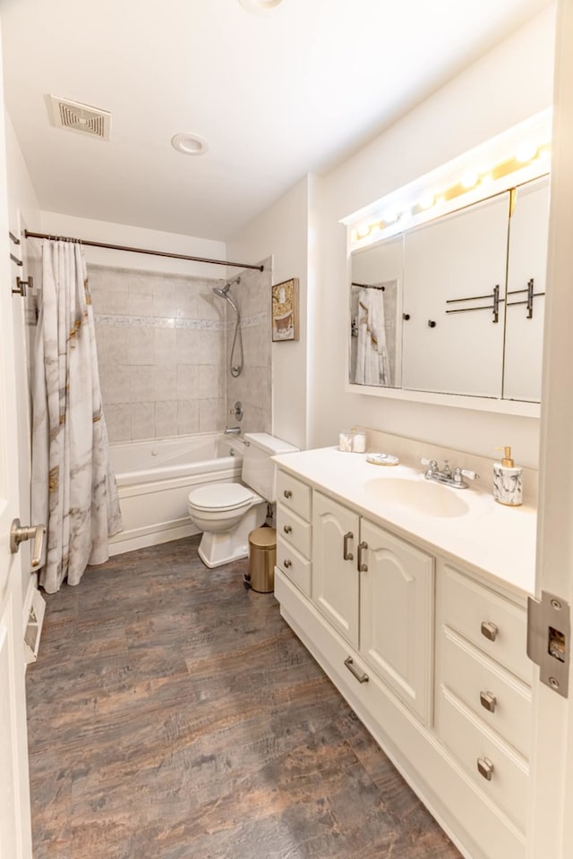 750 Evergreen Ln, Bartlett, IL 60103 - bathroom with toilet, wood finished floors, vanity, and shower / bath combo with shower curtain
