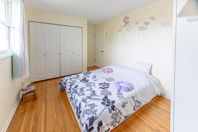 750 Evergreen Ln, Bartlett, IL 60103 - bedroom with wood finished floors, a closet, and baseboards