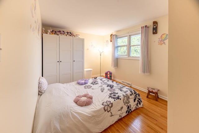 750 Evergreen Ln, Bartlett, IL 60103 - bedroom featuring wood finished floors and baseboards