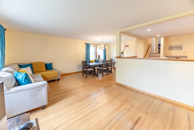 750 Evergreen Ln, Bartlett, IL 60103 - living area featuring light wood-style floors, baseboards, a chandelier, stairs, and recessed lighting