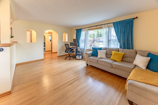 750 Evergreen Ln, Bartlett, IL 60103 - living area featuring wood finished floors, arched walkways, and baseboards