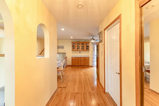 750 Evergreen Ln, Bartlett, IL 60103 - corridor with light wood finished floors, recessed lighting, arched walkways, and baseboards
