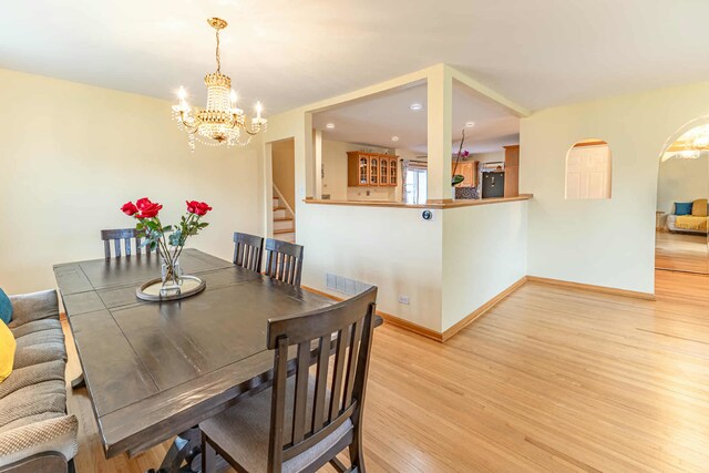 750 Evergreen Ln, Bartlett, IL 60103 - dining area with a chandelier, light wood-style flooring, stairway, baseboards, and recessed lighting