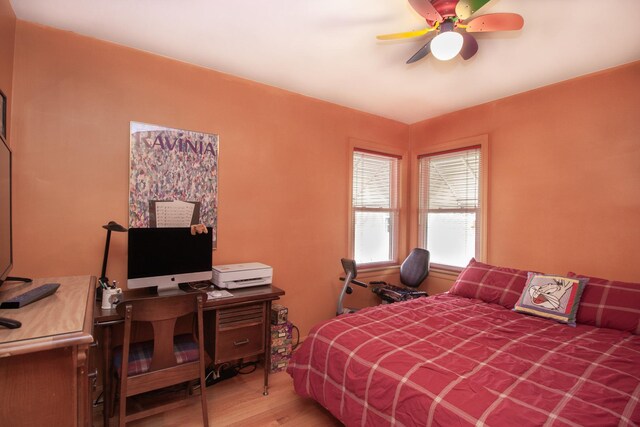 bedroom with a ceiling fan and wood finished floors