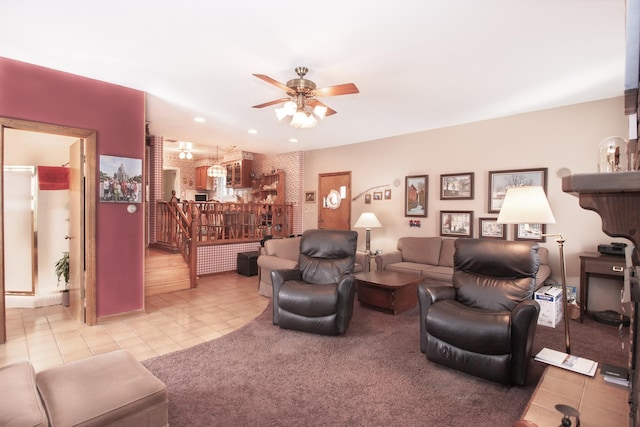 living area featuring a ceiling fan and light tile patterned floors