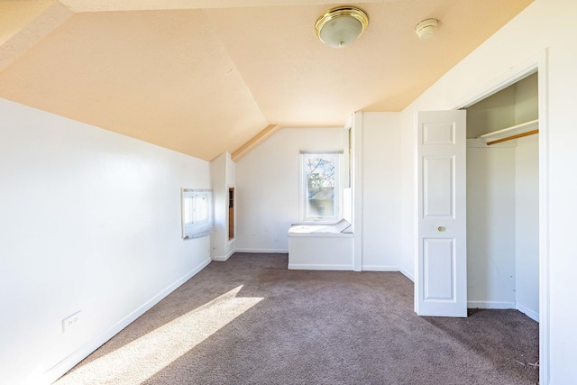 bonus room featuring baseboards, carpet flooring, and vaulted ceiling