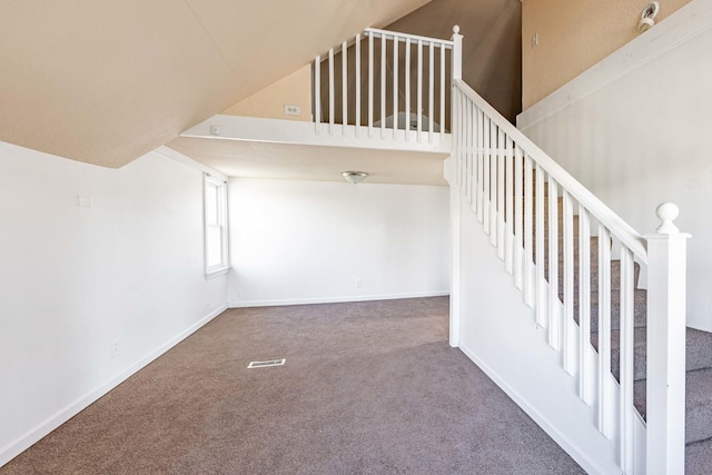stairs featuring baseboards, visible vents, and carpet