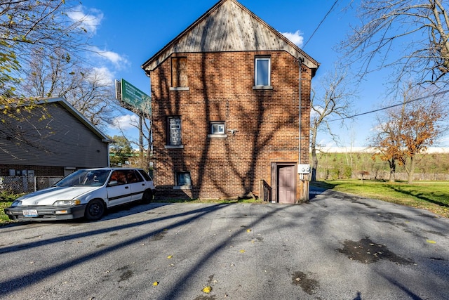 view of home's exterior featuring brick siding