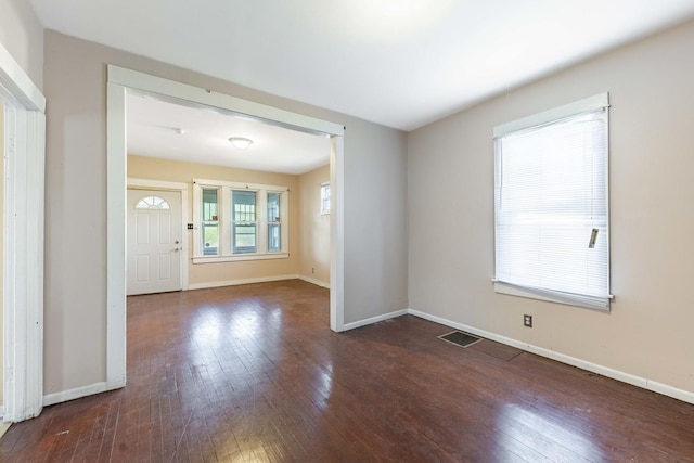 entryway featuring visible vents, hardwood / wood-style flooring, and baseboards