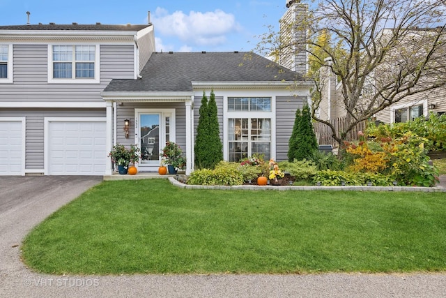 1352 N Knollwood Dr, Palatine, IL 60067 - view of front of house with a garage, a front lawn, driveway, a chimney, and a shingled roof