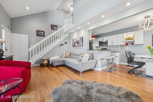 1352 N Knollwood Dr, Palatine, IL 60067 - living room featuring high vaulted ceiling, stairway, beam ceiling, a chandelier, and light wood-style flooring