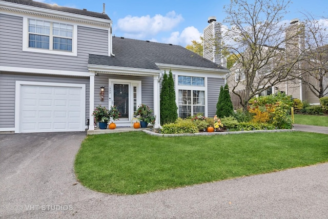 1352 N Knollwood Dr, Palatine, IL 60067 - view of front of home featuring a front lawn, a chimney, asphalt driveway, a garage, and roof with shingles