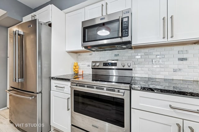 1352 N Knollwood Dr, Palatine, IL 60067 - kitchen featuring appliances with stainless steel finishes, dark stone counters, white cabinets, and backsplash