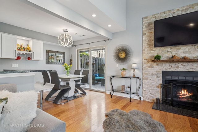 1352 N Knollwood Dr, Palatine, IL 60067 - dining room with a chandelier, light wood-style flooring, a fireplace, and recessed lighting