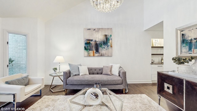 1790 Ashford Cir, Wheeling, IL 60090 - living room featuring high vaulted ceiling, baseboards, dark wood finished floors, and a notable chandelier
