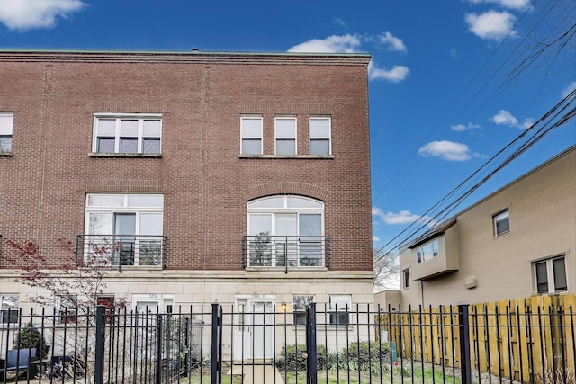 5350 N Damen Ave Unit F, Chicago, IL 60625 - view of property featuring brick siding and fence