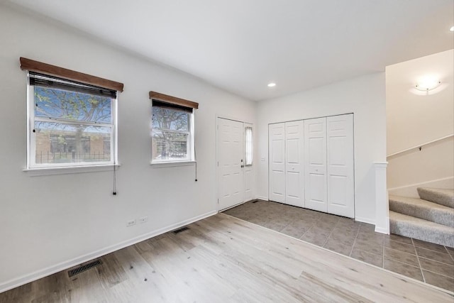 5350 N Damen Ave Unit F, Chicago, IL 60625 - entrance foyer featuring stairway, baseboards, wood finished floors, and visible vents
