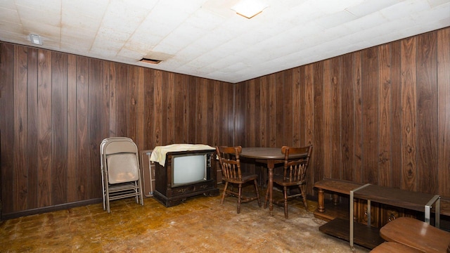 interior space featuring wood walls and visible vents