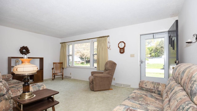 living room featuring visible vents and carpet floors