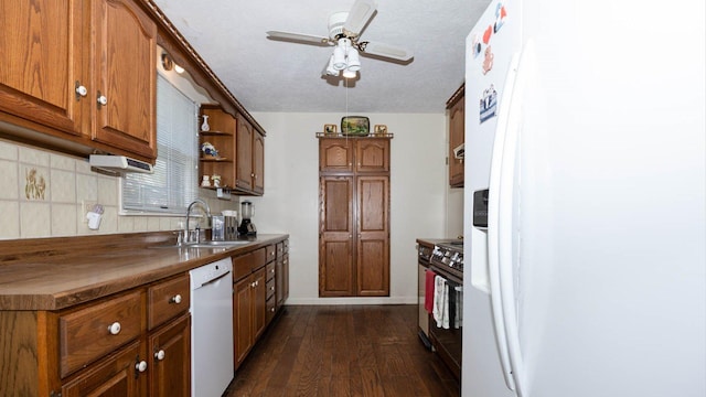 kitchen featuring a ceiling fan, white appliances, a sink, open shelves, and dark wood-type flooring