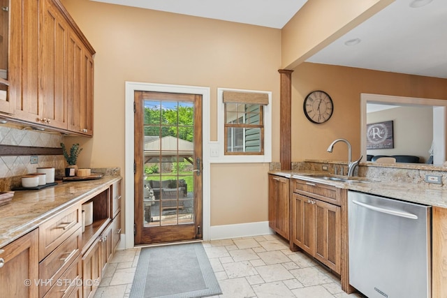 122 Logan Ave, Geneva, IL 60134 - kitchen featuring dishwasher, backsplash, brown cabinets, and light stone countertops