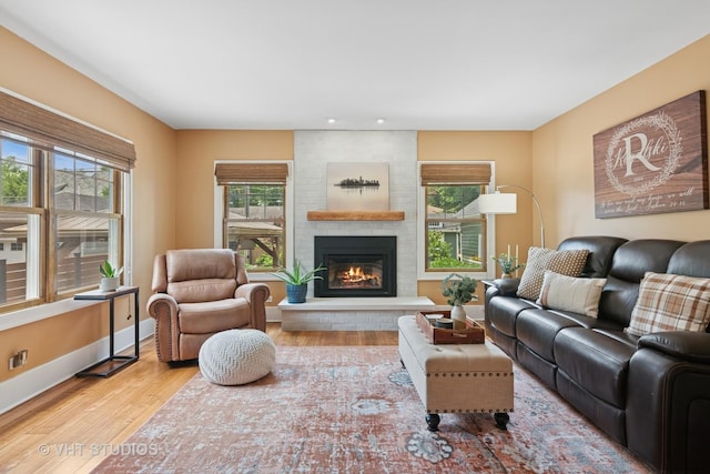 122 Logan Ave, Geneva, IL 60134 - living area featuring a brick fireplace, wood finished floors, and recessed lighting