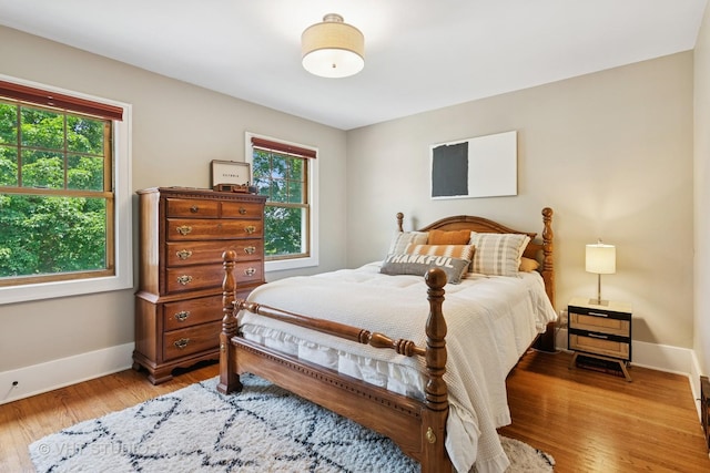 122 Logan Ave, Geneva, IL 60134 - bedroom with multiple windows and light wood-style flooring