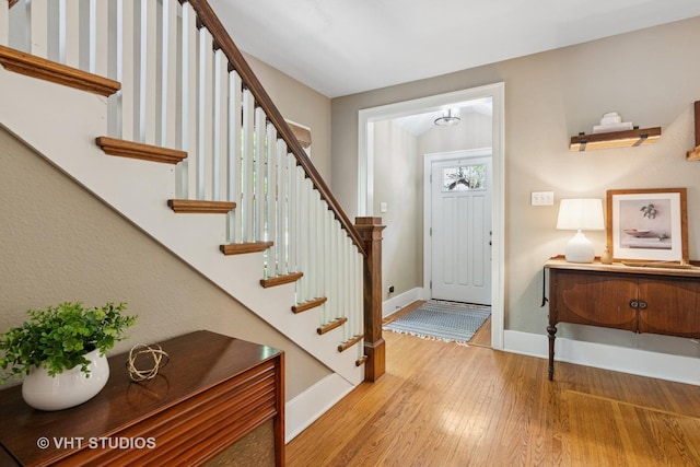 122 Logan Ave, Geneva, IL 60134 - foyer featuring stairway, wood finished floors, and a chandelier
